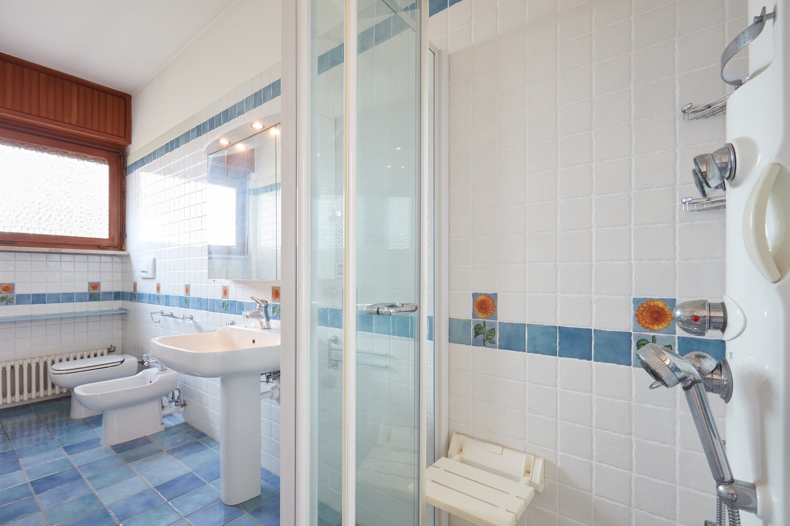 Normal bathroom with large shower in apartment interior